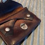 Gammal portmonnä i skinn