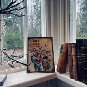 Metallram dekorativ - med äldre tidningsurklipp "Blåsorkester"